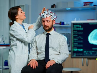 Patient with brain scan discussing with researcher neurological doctor while adjusting brainwave scanning headset examining diagnosis of disease, explaning eeg results, health status, brain functions SSUCv3H4sIAAAAAAAACpRVy47cNhC8B8g/LHgOETZJkWK+IBeffAxy4Gt2BEviQNLYMRb772lJQw2llWH4NuouNrurmjVvv//28kKcHRtP/np5m7/wu2nb+zgNdmpSj2H2xyM+xD7EoYx8HYRiZSCGZkpDY9sy6Ozkr73tIgb7e9vO4fclScbJTvcxjsXtXeOHNE7Jf7lhG5iAXKfD8O2aprSL2pBcXPAY5TqHx+t9muKQE9WGD/GWxuZZ6HnklvpQ7SK2td33XaRLMyuxjV3sp/m42KZsXteu58JlIgzRduPULPM/K/nUpvvg0n/lMMDFcNnB4vcYuxLibb+7h+uCT2+n+IoC7BjN+v6zfr/kxKPchCnyd7TtdPV2iH9+QhE9Kvi4cGXz7mbUp2b0sW1tHxNKk/Pr3T8o/Nk3sffxF6qtP/7dNHjF87MIb+/FoANKYNfFeYxFHHeWR+GpFFBRWQdPnWOSXkQVAMCG4C65DcJZbRVYRQG4olIqTWumJWVOBPB1BdaoDayCrDSYmnJvBZWMM1obHagVGnhw3EJ4Vg5wUV5iB1UFnMrAHbUyGsqClhcAd1GBLcOuE5Iv33BNu0Wvx2z2HppU6Pc1oRzLrhUE3IbGN/1rcSxN1+V15mM+3ftpmJkjW3NtSjfr2nkTL1gz5vjVjiPCQ46XK4VekLrinj5NC++PqiTgzs2fILjiYAyAFnXFOQdSPvJrg3WWdnKD91ubbIjzpdvinDx/hfVkbWq5rdDBCRaAqVU2nKMpLICKGVk/AQd7OIMcjeIMky3jLJfN4yz3wUZWEAiWH/6JozwwkpuiydJcHoBKFkV2NnOSz45zltu856zuwYZWDOear5BsCvNj7xrkei/zR4E0VEz9hP0DZse+BsWrn5B3wJyrcAB9ZFiDluoHDB5yZ2t2gJwRKVHlypyvkua4AdWD5N1fKRZpQmn8O5KJ5FLV0gj9tKoDx0QqMEyC4RskU0wA9WdKCLGljgwTND2ulaqeF3wgmICqqkro+tlDSS/B2YyWTJotn9lFoH1No8d+8AQHJhljhUcfmCaA7w1ACsE2yJFpglZVgygIyTwTIUVECSRVNdRUOqGpERdJgwLvhLksBv4gvpk3mzhjQVmvqPXg8C/IM2oMF9Q7Jx02jMxLPPX+PwAAAP//AwBk7IXRcwkAAA==